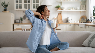 Woman sitting at home in casual clothing